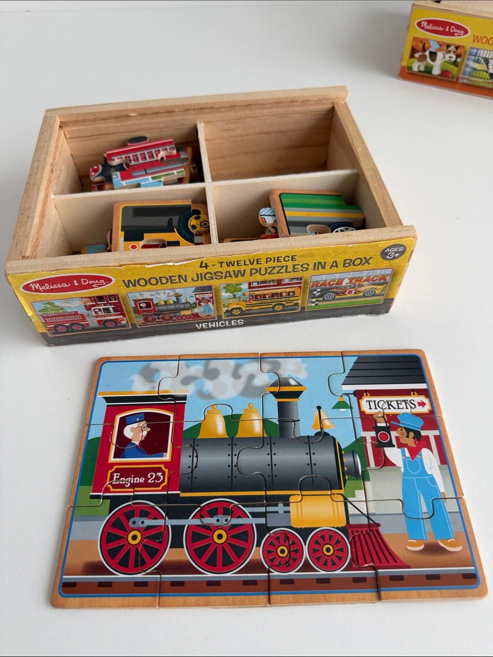 Melissa & Doug Box Puzzles - Wooden Jigsaw Puzzle - Train Firetruck Race Car Bus